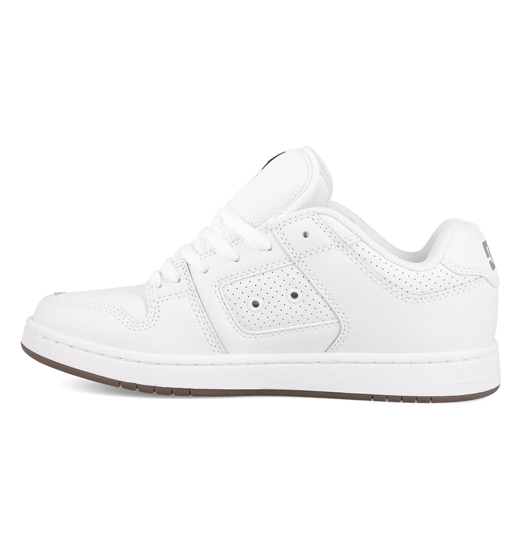 A white low-top sneaker with a rubber sole, white laces, perforated side details, and subtle DC Shoes branding near the heel—the Women’s Manteca 4 Shoes by DC Shoes are shown in a left-facing profile view and boast a performance-focused design that balances style and comfort.