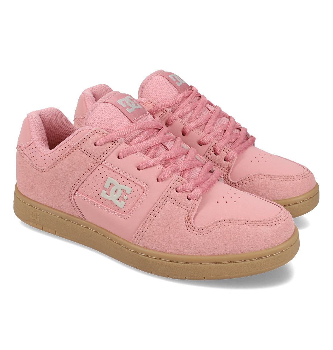 A pair of pink Women’s Manteca 4 Shoes by DC Shoes with gum soles, showcasing a classic design with a white DC logo on the side and pink laces, displayed at a slight angle on a white background.