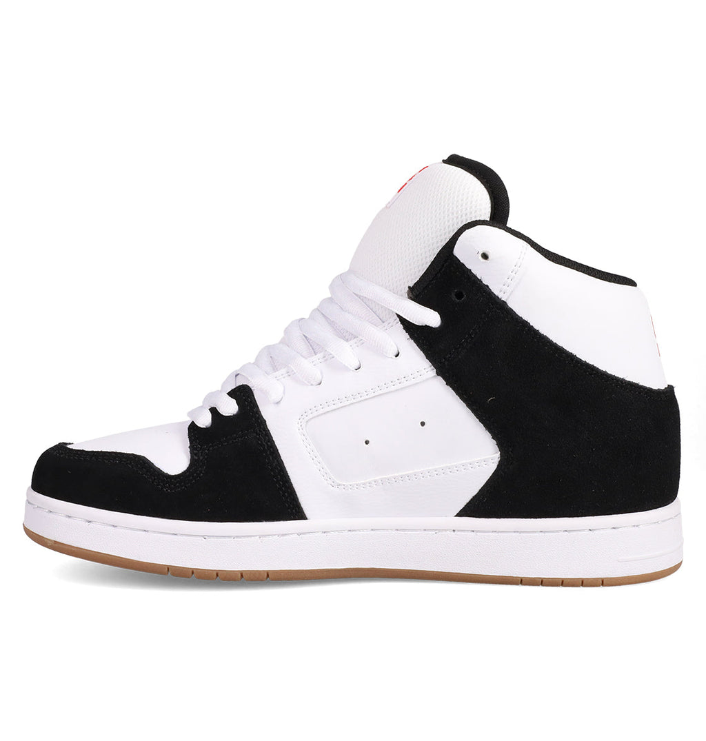 The DC Shoes Men's Manteca 4 Hi features a vintage high-top design with a white upper, black suede overlays, white laces and midsole, plus a light brown rubber outsole, shown in side profile.