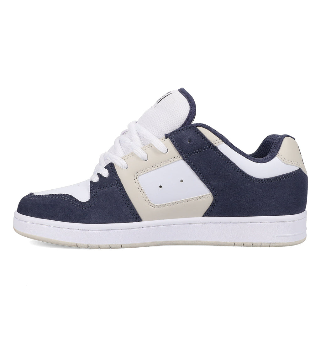 A low-top skate shoe with a white sole, white laces, and a combination of navy blue and white panels on the upper, viewed from the side. The DC Shoes Men’s Manteca 4 Shoes feature a performance-focused design ideal for both everyday wear and skateboarding.