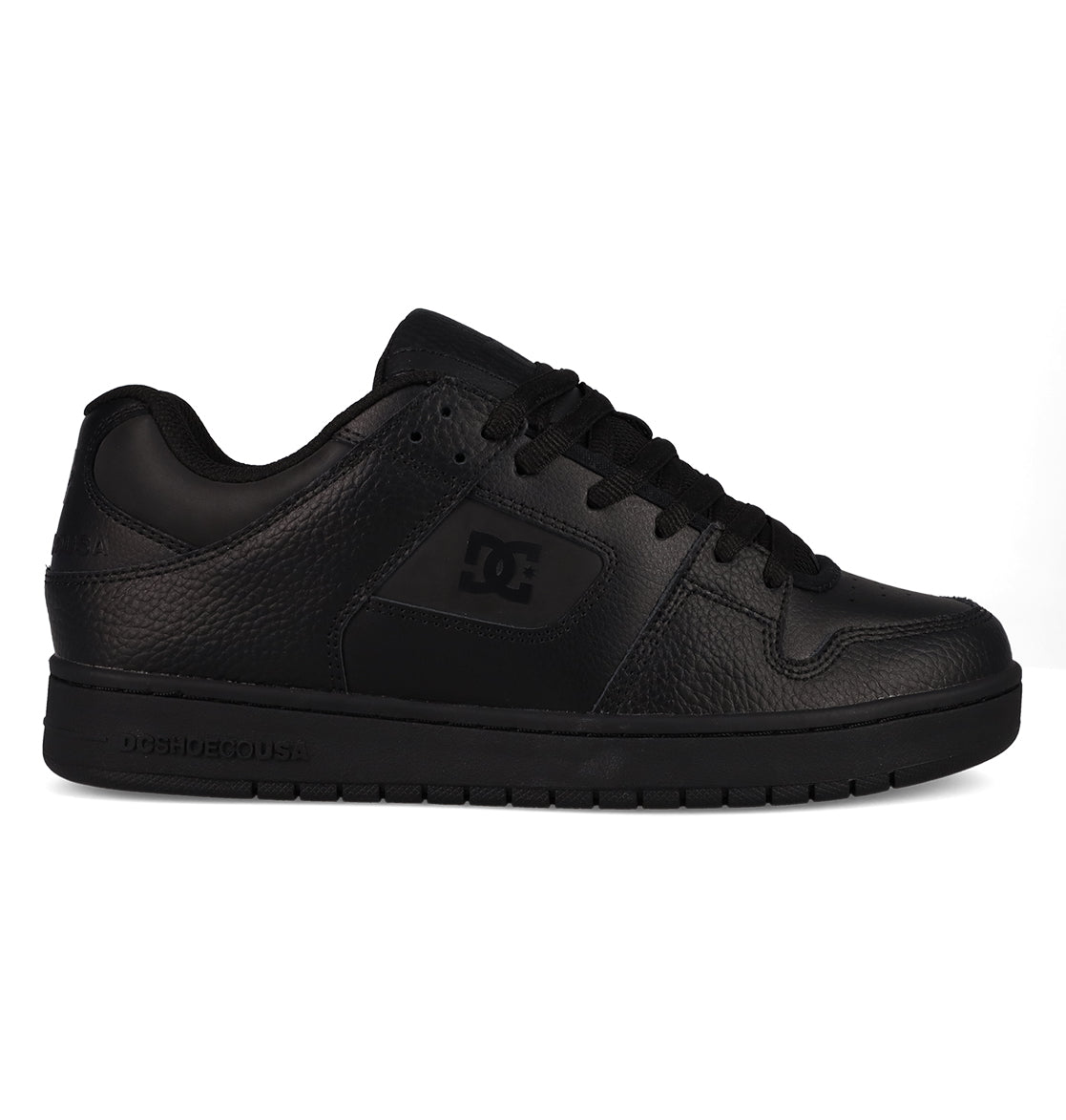 A black low-top Men’s Manteca 4 SE Shoe by DC Shoes, featuring a textured leather upper, black laces, and a flat rubber sole. This performance-focused skate shoe displays the iconic DC Shoes logo on the side panel and is presented in a right-facing profile view.
