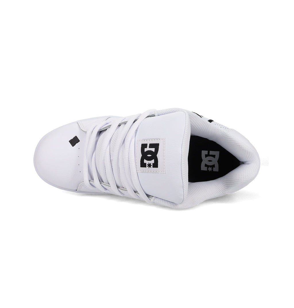 Top view of Men's Net Shoes by DC Shoes featuring white laces, a black DC logo on the tongue, black branding on the insole, and crafted with durable fabrics for lasting comfort.