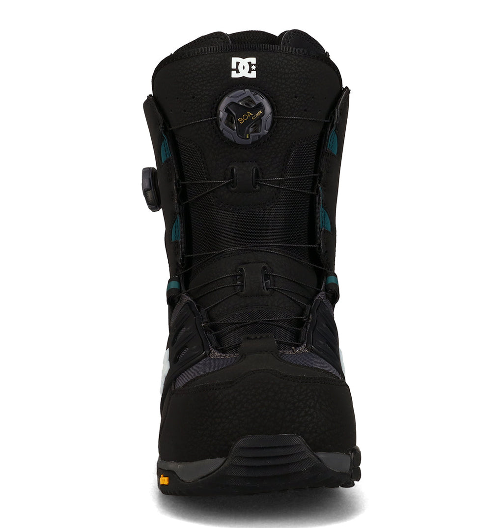Front view of the DC Shoes Men’s Phantom Snowboard Boots in black, featuring a round BOA lacing system, teal accents, and the DC logo at the top. This boot has a textured toe and a rugged sole for traction, making it an ideal choice for any winter adventure.