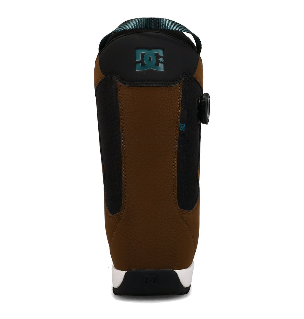 A brown and black DC Shoes Men’s Phase Boa Pro Snowboard Boot, shown from the back, features a teal DC Shoes logo at the top and a white sole. This stylish design delivers the support and performance you expect from DC’s Phase Boa Pro snowboarding boots.