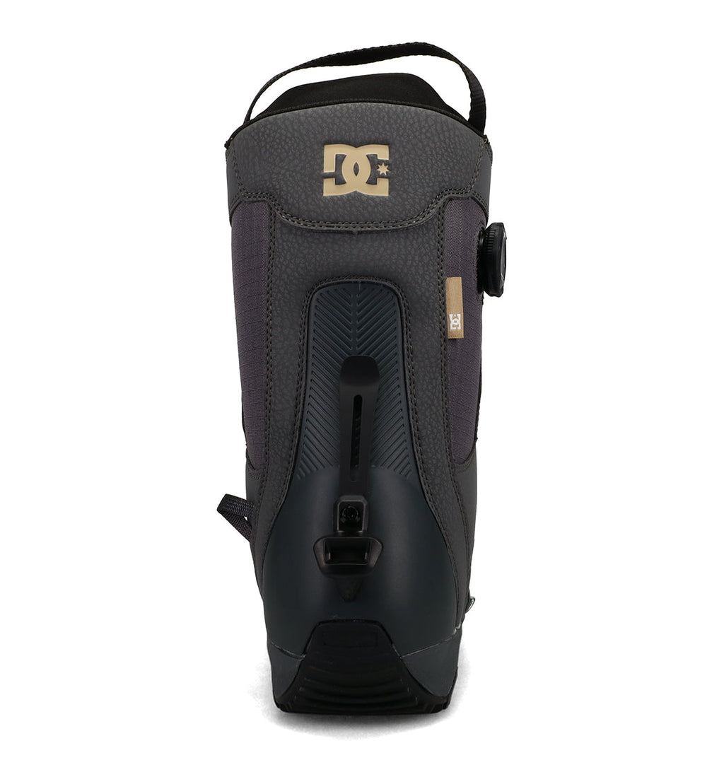 A rear view of the black and gray DC Shoes Men’s Phase Boa Pro Step On Snowboard Boots, highlighting a textured upper, pull loop, DC logo at the top, and Boa lacing adjustment dials and fastenings on the heel for secure support.