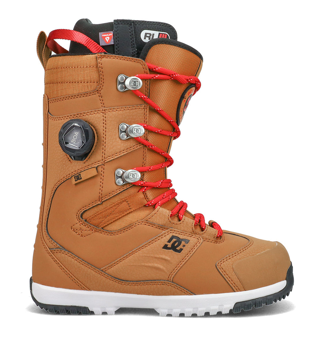 A single brown DC Shoes Men’s Premier Hybrid Snowboard Boot featuring red laces, a BOA dial, metal eyelets, and a black-and-white sole. The DC Shoes logo appears on the side of the boot, which is displayed in profile against a white background.