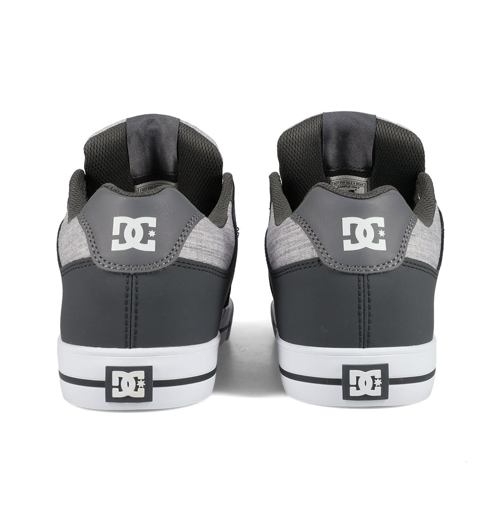 A pair of DC Shoes Men’s Pure Shoes in gray are shown from the back, featuring white DC logos on the heels and soles, along with white midsoles and black detailing—these comfortable sneakers are a versatile choice for any casual outfit.