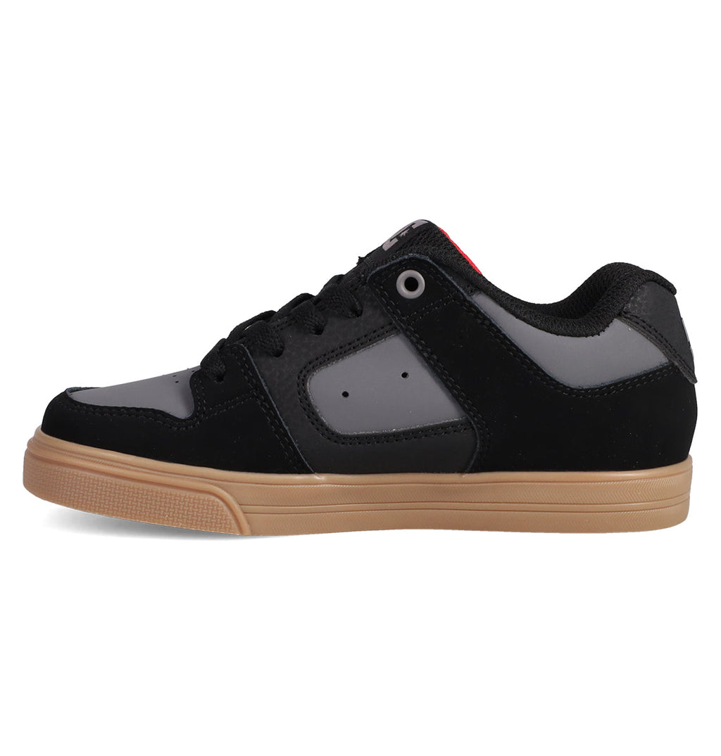 The Kids' Pure Shoes by DC Shoes feature a black and gray skate-inspired design with a gum-colored sole, black laces, and a low-top profile—perfect for everyday wear.