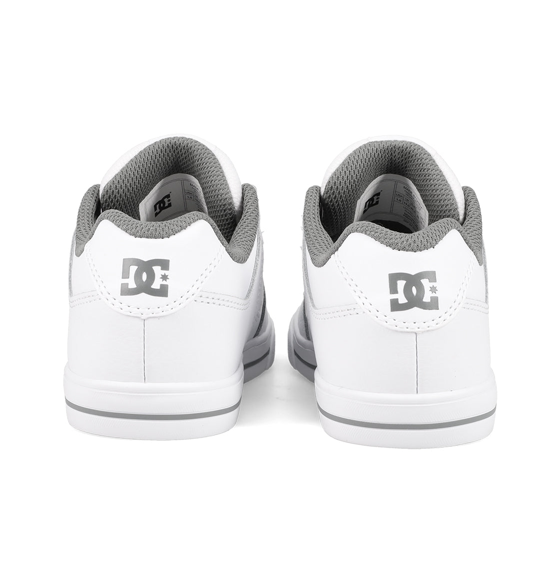 Back view of a pair of durable DC Shoes Kids’ Pure Shoes in white, featuring gray interiors and the DC Shoes logo in gray on the heels. These comfortable skate shoes for kids are positioned side by side on a white background.