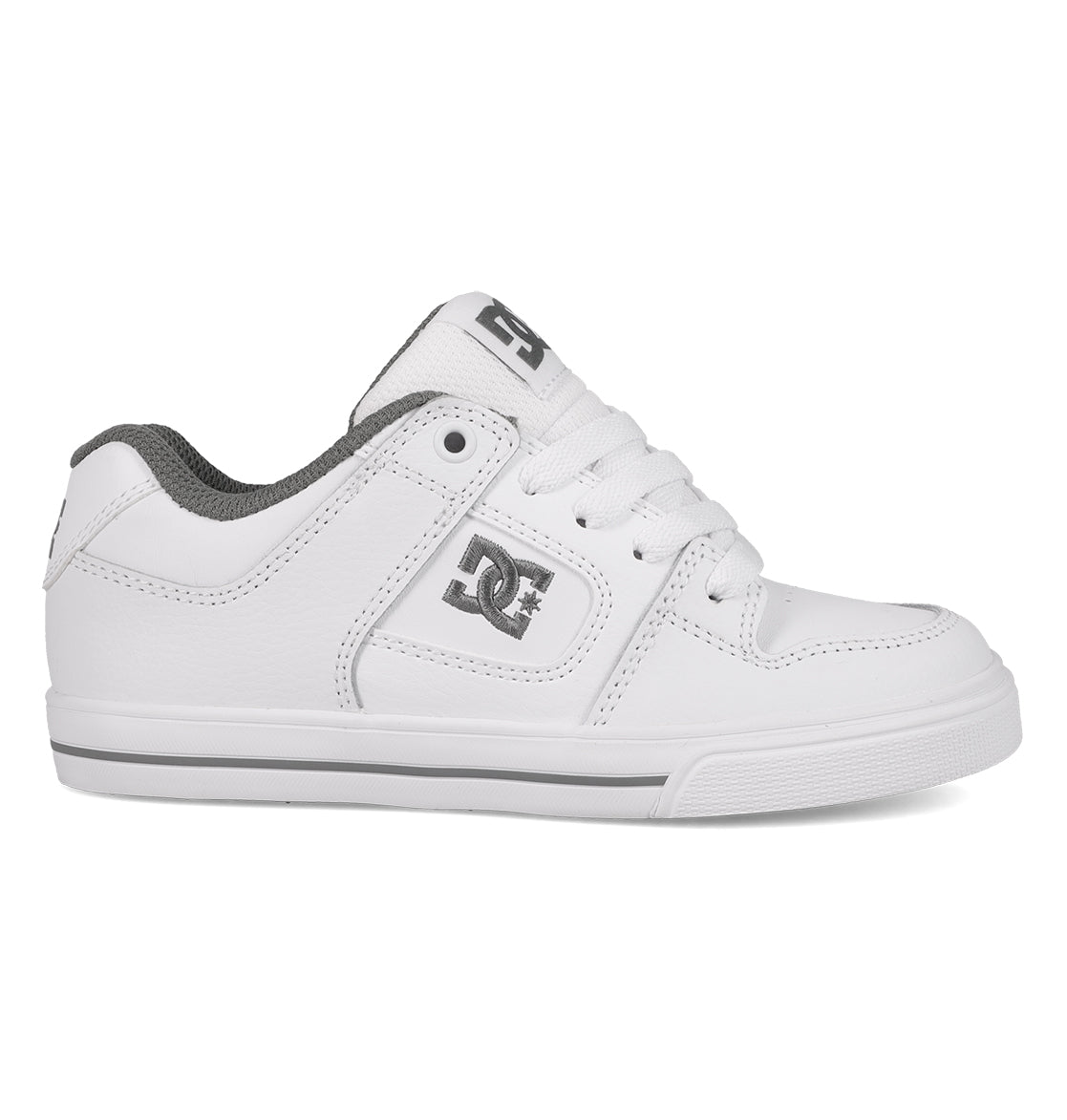 A comfortable and durable white Kids’ Pure Shoe by DC Shoes, featuring gray accents, a lace-up front, and a gray DC logo on the side and tongue, displayed in a left side profile view against a white background.