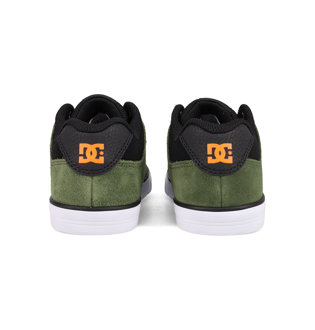 A pair of DC Shoes Kids' Pure Shoes seen from the back, with green suede uppers, black accents, white soles, and orange DC logos on each heel—stylish and comfortable footwear for kids.