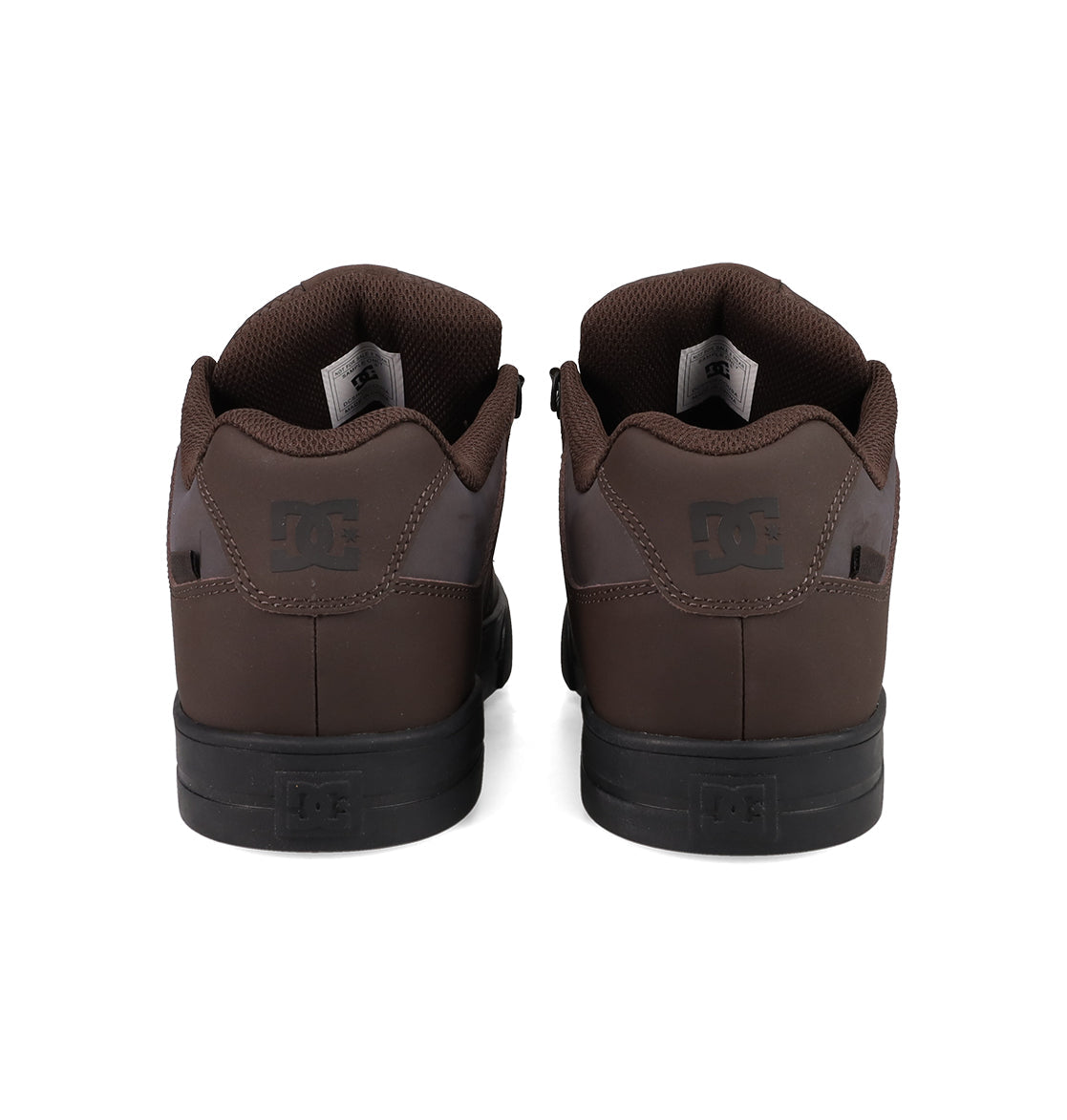 A pair of brown DC Shoes Men's Pure Shoes are shown from the back, displaying black soles and the DC logo on the heel tabs—ideal for daily comfort and style.