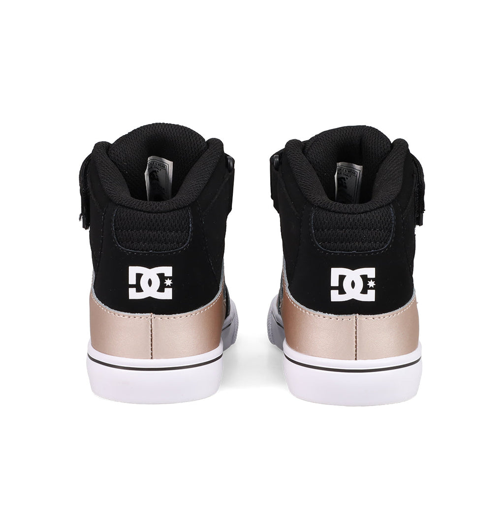 A pair of DC Shoes Kids' Pure Hi Top EV Shoes seen from the back, featuring black uppers, metallic gold heel panels, white vulcanized soles, and white DC logos on the heels.