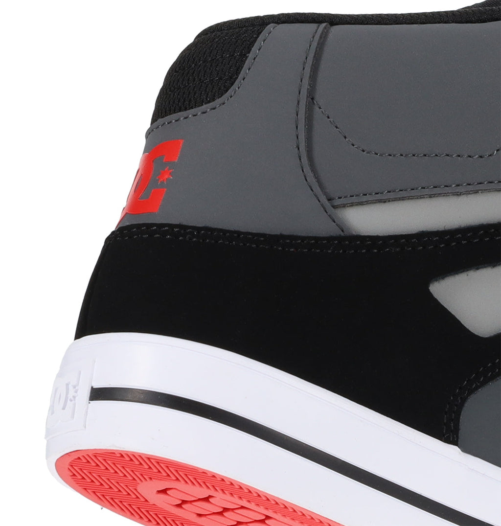 Close-up of the heel of the DC Shoes Men’s Pure High Shoes, a versatile men’s shoe featuring black, gray, and red colors, with the DC logo in red on the side and a white rubber sole with red accents visible on the bottom.