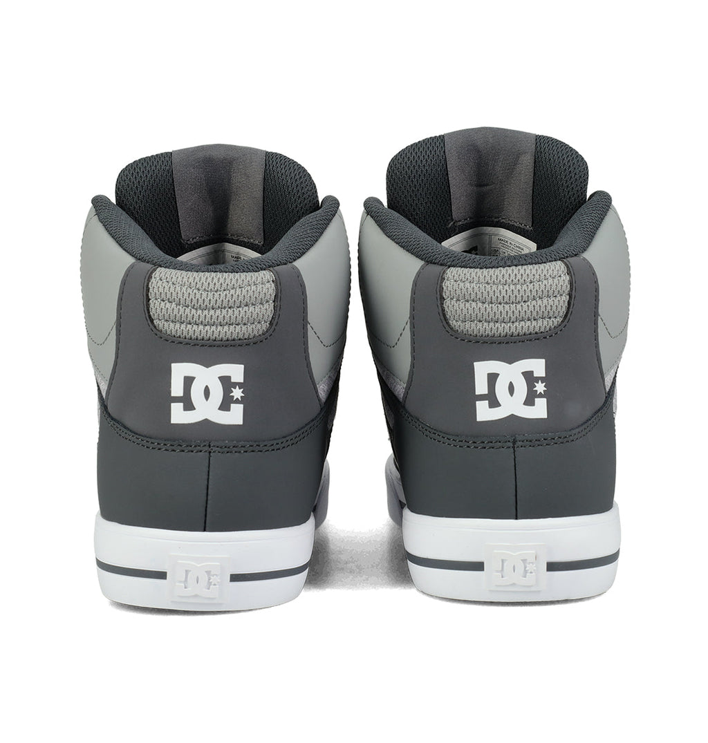 Back view of a pair of Men’s Pure High Shoes by DC Shoes, featuring a gray and black high-top design with white soles and the iconic DC logo on the heel—these versatile sneakers are crafted to provide both style and comfort for men.