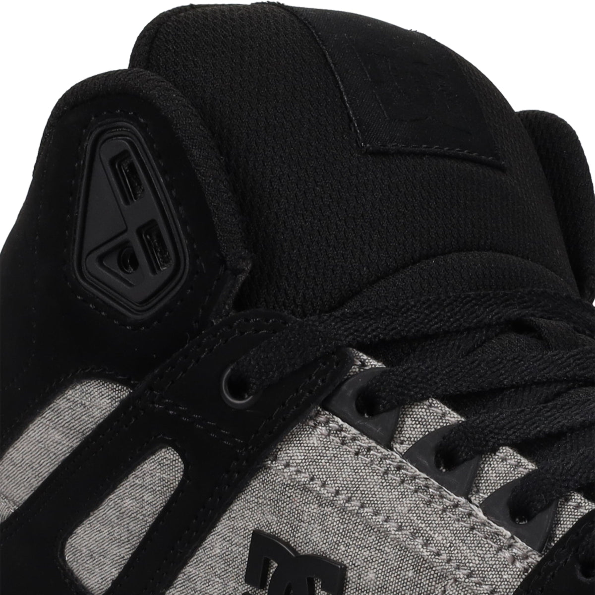 Close-up of the Men’s Pure High-Top Shoes by DC Shoes in black and gray, featuring black laces, distinct black stitching, and prominent DC Shoes logos on the tongue and side—all designed for everyday comfort.