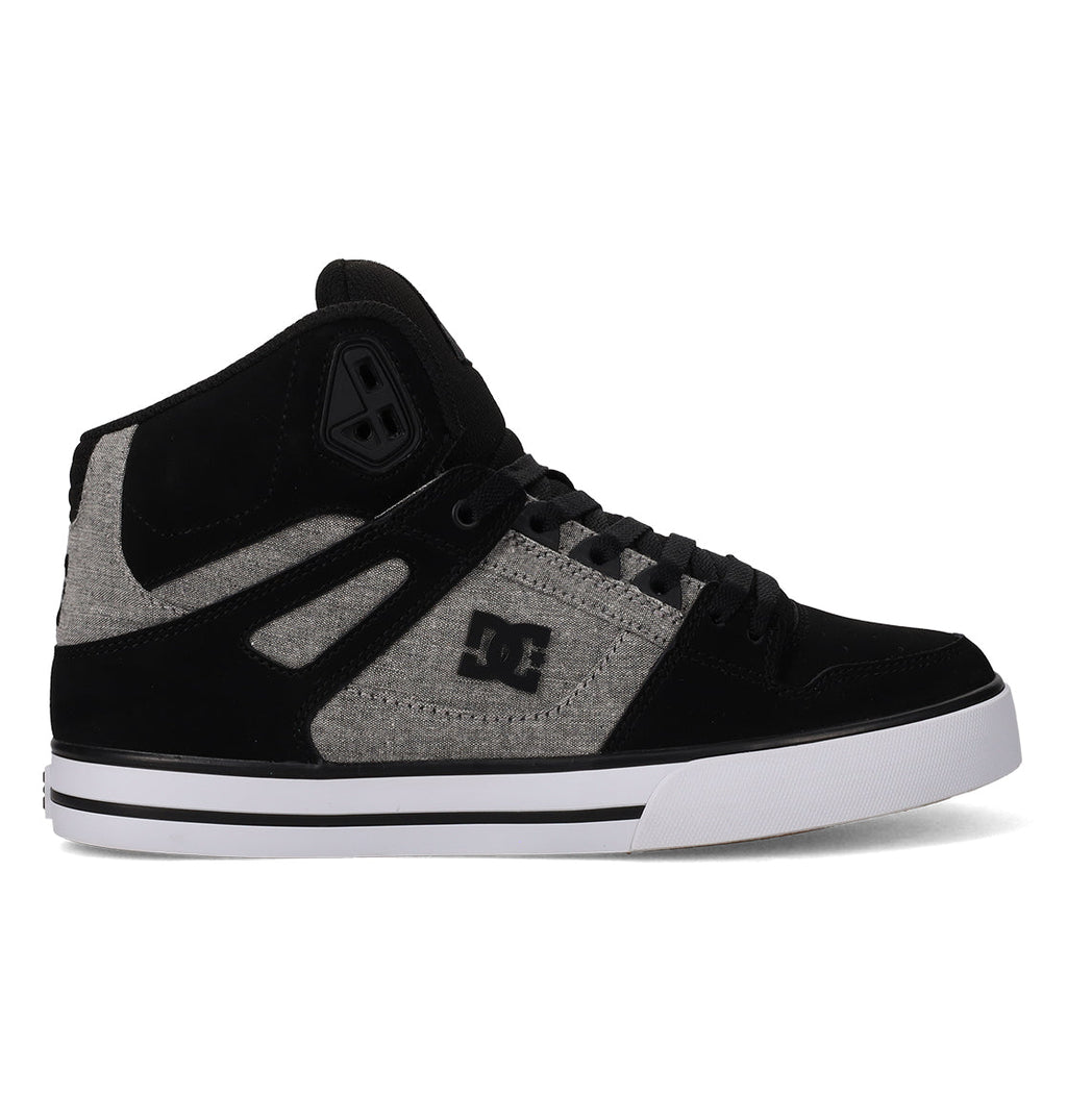 A pair of DC Shoes Men’s Pure High-Top Shoes in black and gray, featuring a white sole, black laces, and the iconic DC Shoes logo on the side. Constructed from a combination of suede and fabric materials, these high-tops offer both durability and comfort for everyday wear.