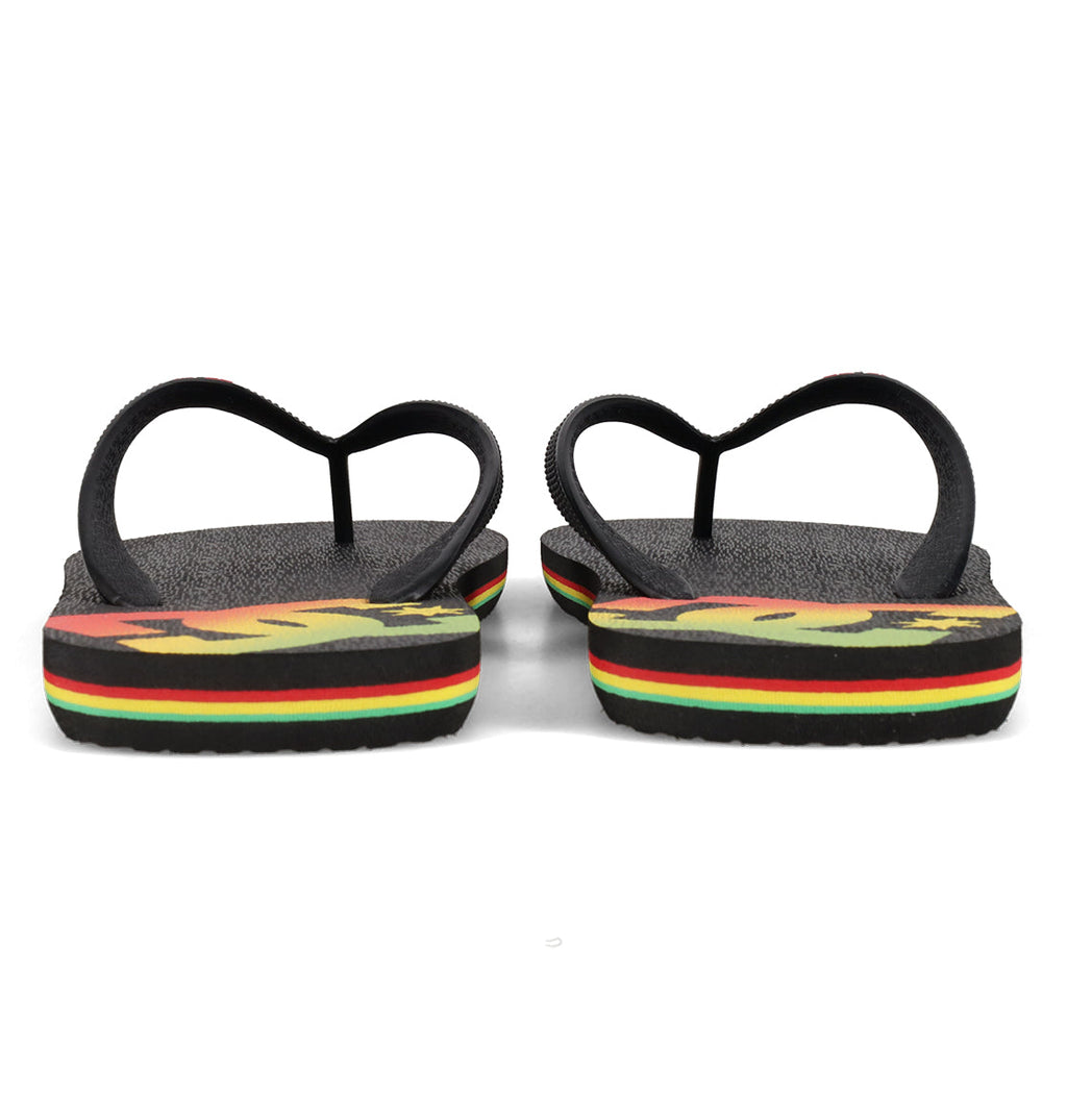 A pair of DC Shoes Men’s Spray Slides viewed from the back, featuring black straps and soles accented with red, yellow, and green stripes—these must-have slides are perfect to slip on after a long skate session.