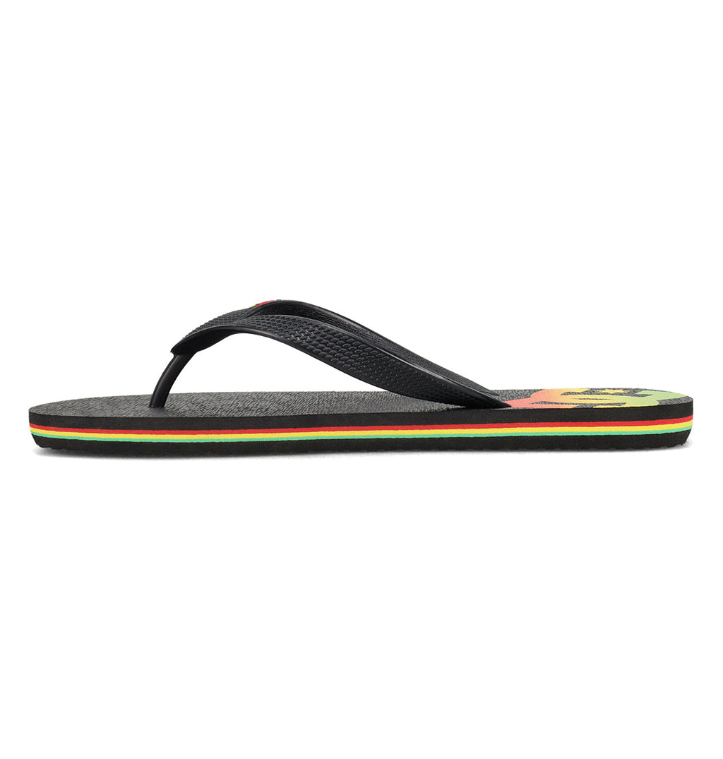 The Men’s Spray Slides by DC Shoes feature a black design with a textured strap, multicolored sole stripes in red, yellow, and green, and a partial yellow-red graphic on the heel—perfect for slipping on after a skate session or for casual everyday comfort.