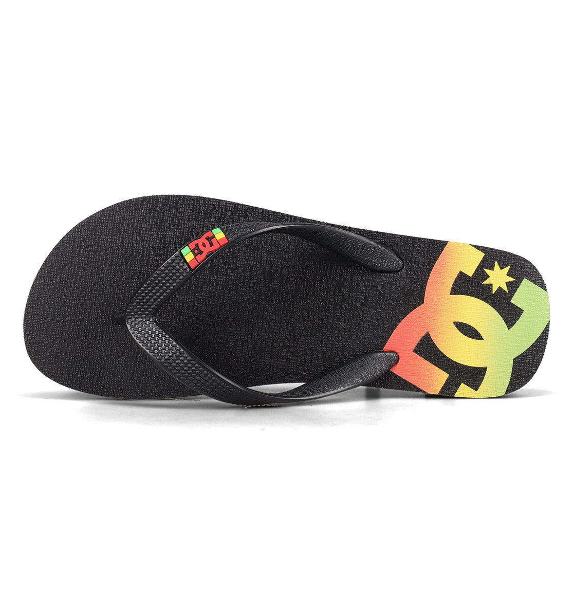 Check out the Men’s Spray Slides from DC Shoes—a black flip-flop featuring textured straps and a vibrant yellow, orange, and green DC Shoes logo on the footbed. These must-have slides are perfect to slip on after your next skate session.