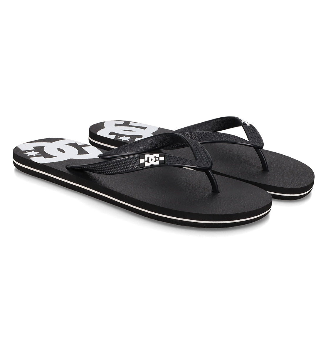 A pair of Men’s Spray Slides from DC Shoes, featuring black straps and a white DC Shoes logo on the footbed, these essential slides are perfect for relaxing after a skate session and are showcased on a clean white background.