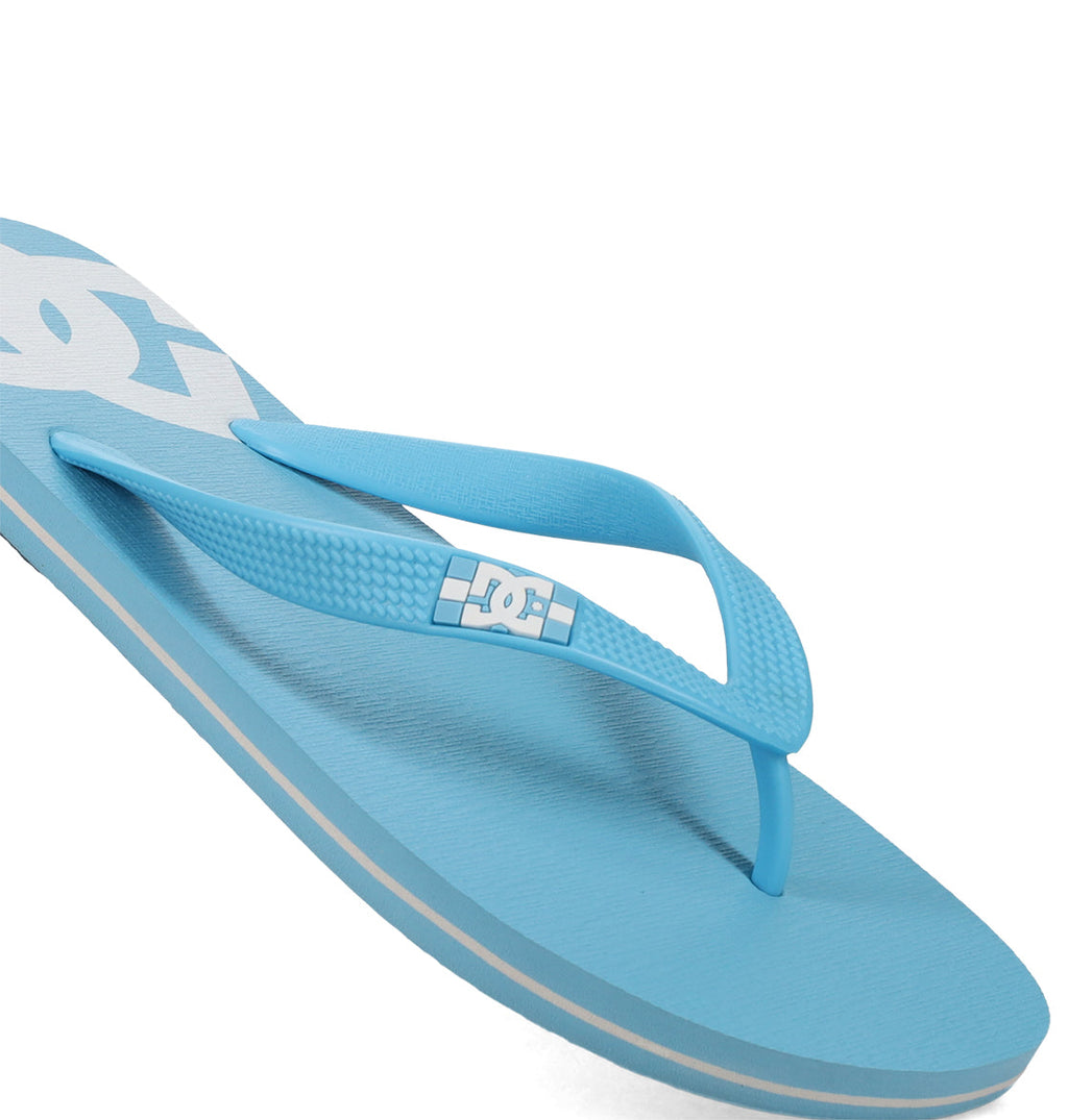 A close-up of DC Shoes Men's Spray Slides in light blue, featuring textured straps and the DC logo in white near the heel—ideal for skate sessions or casual days out.