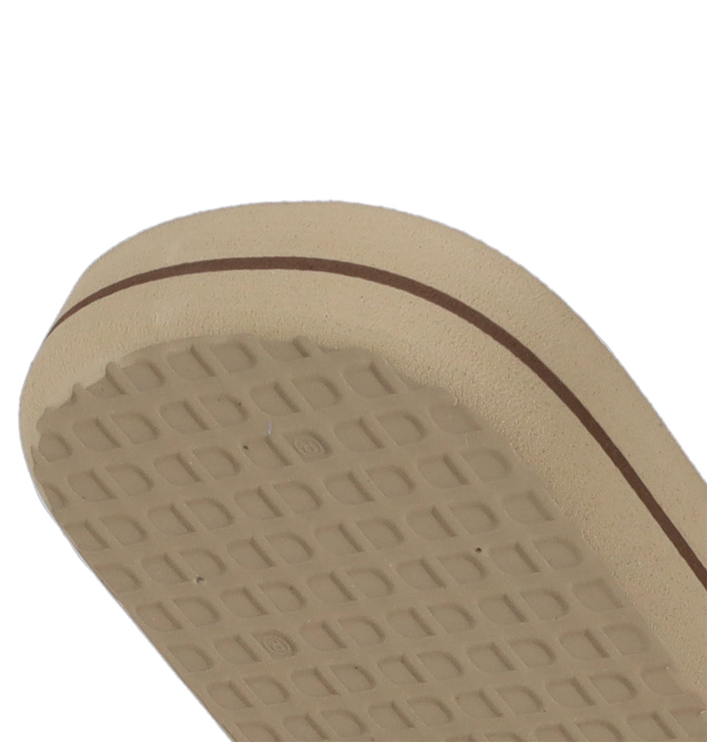 A close-up of the sole of DC Shoes Men's Spray Graffik Slides, showing a grippy textured pattern and a brown stripe along the edge—ideal for your next skate session.