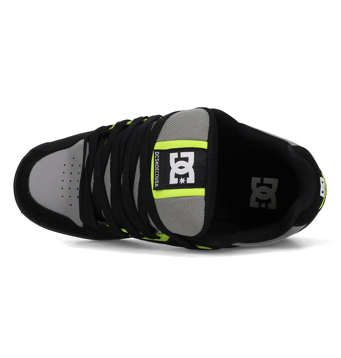 Top view of the Men's Stag Shoes by DC Shoes in black and gray with neon green accents, black laces, visible DC Shoes logos on the tongue and insole, and a durable cupsole for added support.