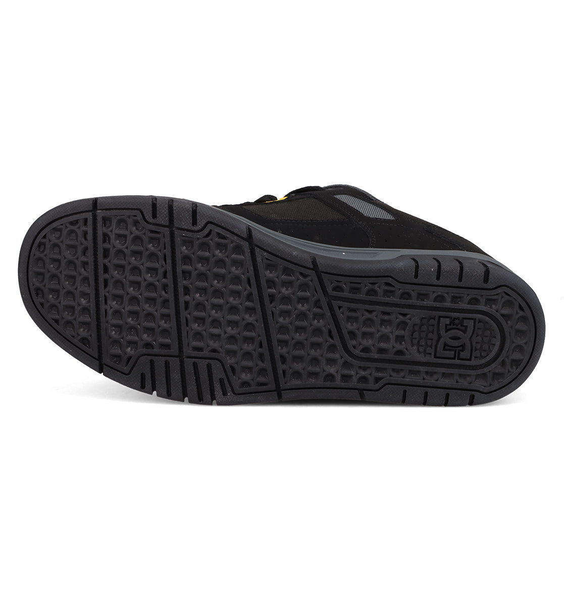 Bottom view of the Men's Stag Shoes by DC Shoes, featuring a textured, durable cupsole with geometric patterns and the embossed DC logo near the heel—a classic tribute to skate culture.