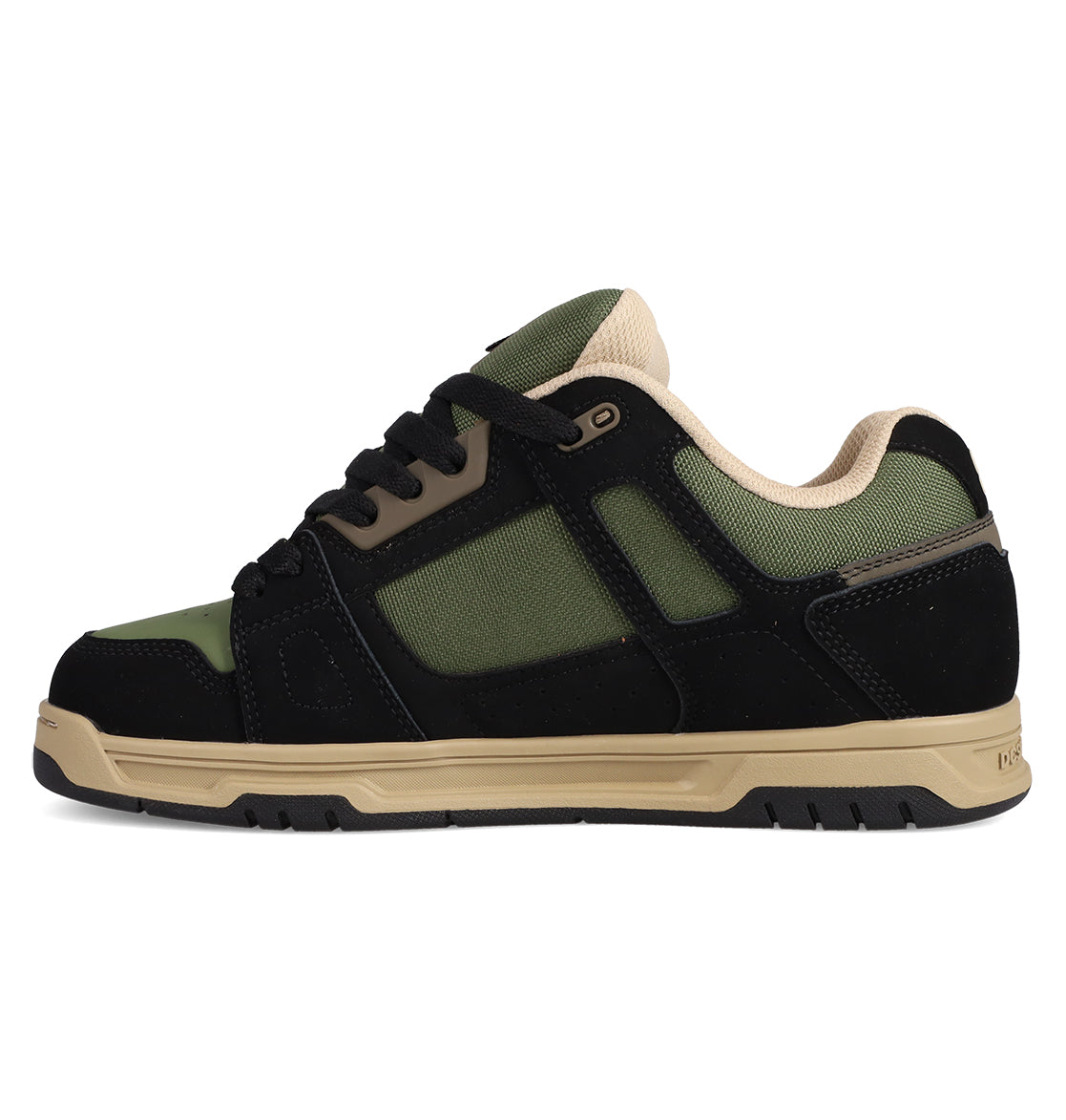 The DC Shoes Men's Stag Shoes are black, green, and beige low-top skate shoes with a thick cupsole, mesh panels, suede overlays, black laces, and a padded beige collar. Shown in profile on a white background. Inspired by the classic Stag style.
