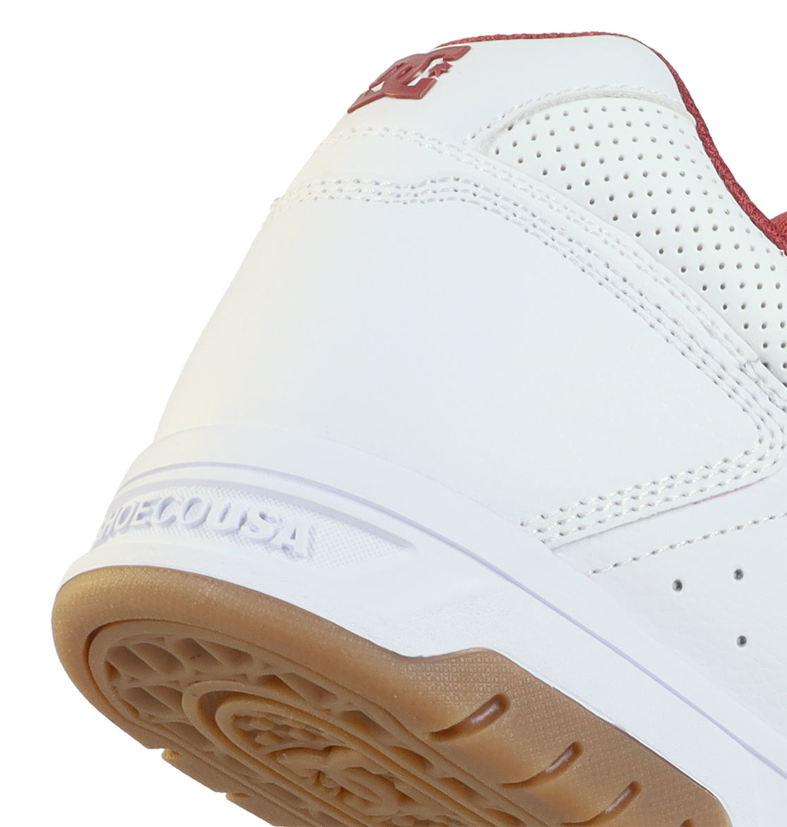 Close-up of the heel and sole of the Men’s Stag Shoes by DC Shoes, featuring a durable cupsole, gum outsole, red trim, perforated details, and SHOECOUSA embossed on the midsole.