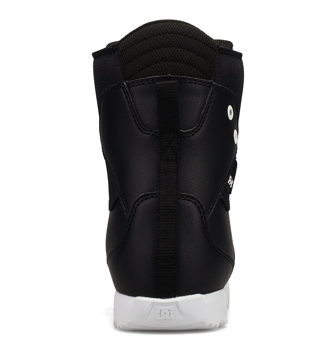 A black Kids’ Scout Snowboard Boot by DC Shoes is shown from the back, featuring a pull tab, white outsole, and subtle stitching details. Designed for support and comfort, the boot has a padded collar and two metal eyelets on the side to ensure a secure fit.