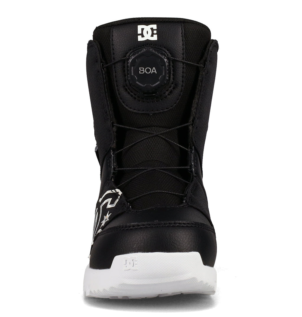 Front view of the DC Shoes Kids’ Scout Snowboard Boot in black with a white sole, featuring a BOA tightening system on the tongue for a secure fit, support, and comfort. The boot showcases a white DC logo near the toe and on the tongue.