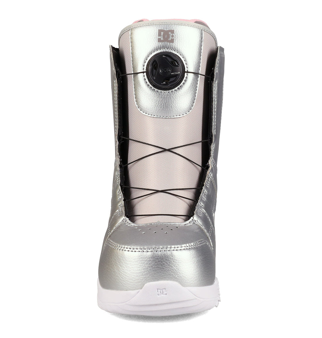 DC Shoes Women’s Phase BOA® Snowboard Boots in silver, featuring black laces, a round BOA® Fit System dial for tightening, and a white sole with IMPACT-ALG insoles, are shown from the front against a white background.