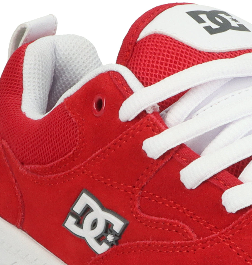 Close-up of the Men’s Ascend Skate Shoe by DC Shoes in red and white, highlighting the signature side logo, crisp white laces, and a glimpse of the white interior lining—a perfect fusion of modern comfort and classic DC style.