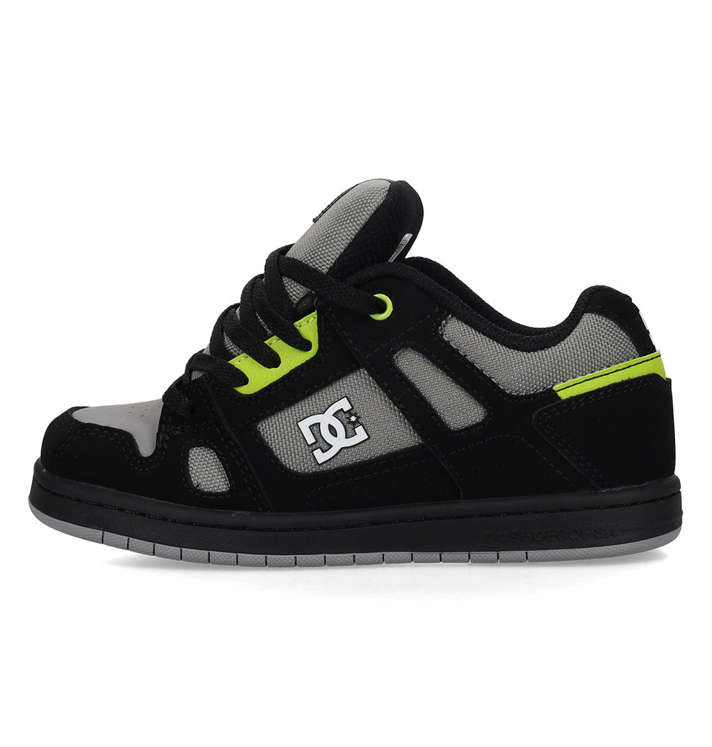 The Kids’ Stag Shoes by DC Shoes feature a black, gray, and neon green design with the signature DC Shoes logo on the side, black laces, and a thick rubber sole—the minimal silhouette makes them an ideal choice for everyday wear.