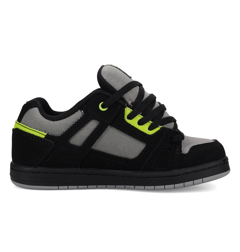 The DC Shoes Kids’ Stag Shoes are shown from the side on a white background, featuring a mix of black, gray, and neon green with black laces. Mesh and suede-like panels give these sneakers a sporty, casual vibe and a minimal silhouette that makes them perfect for everyday wear.