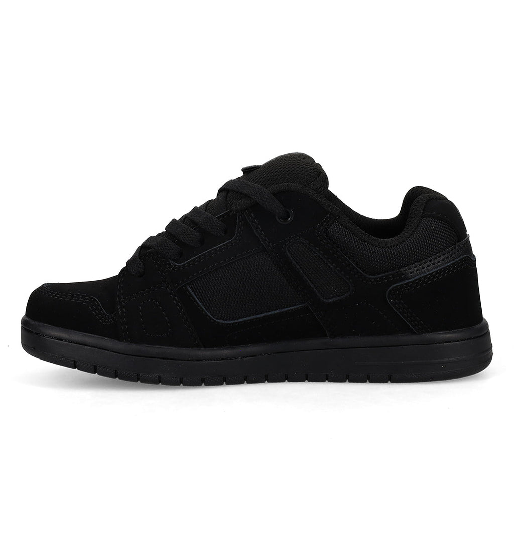 The DC Shoes Kids’ Stag Shoes are black athletic sneakers with a durable cupsole, mesh and suede-like panels, and black laces, shown in a side profile view on a plain white background.