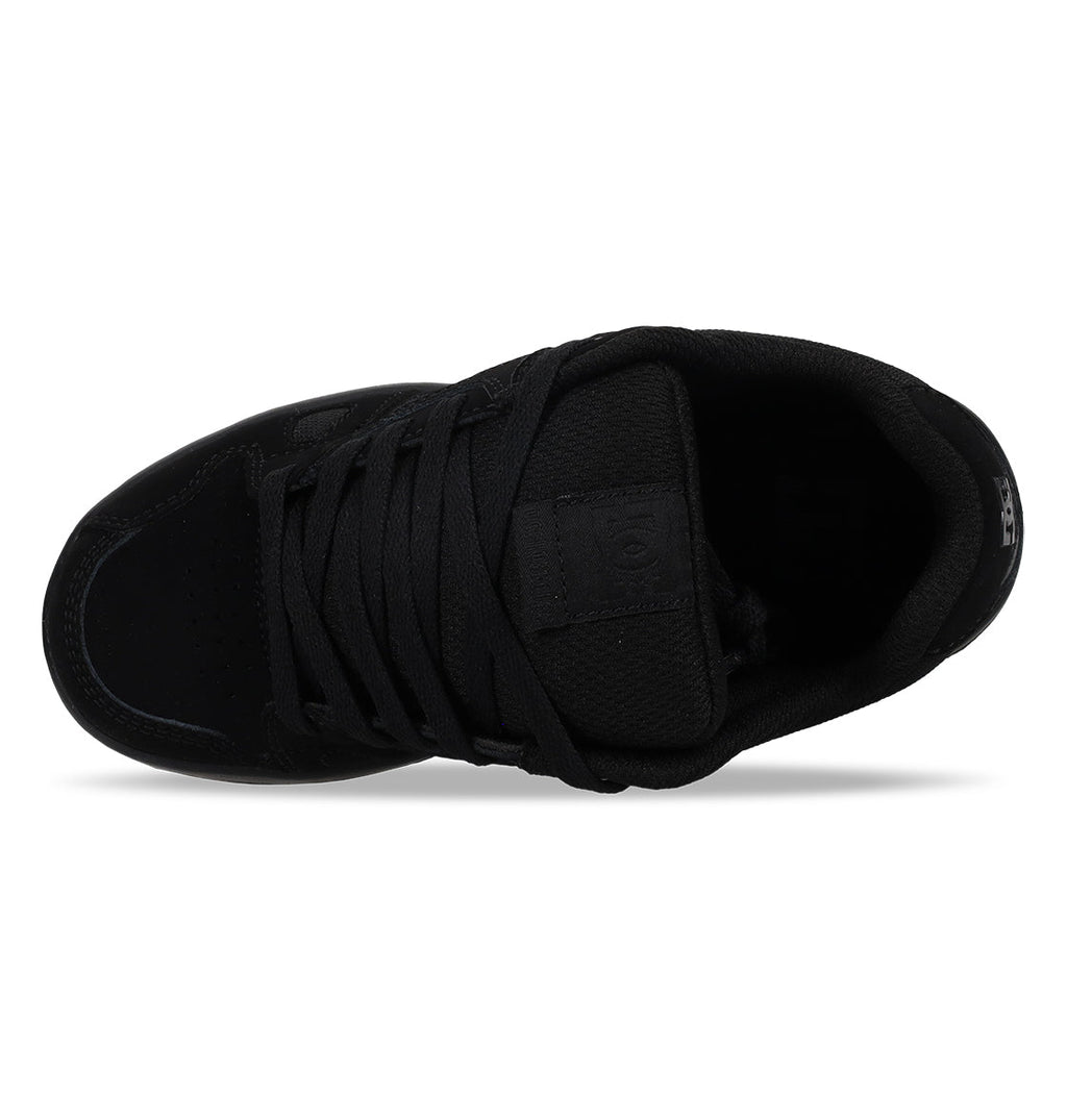 Top view of the DC Shoes Kids’ Stag in black, featuring black laces, tongue, and sole with an oversized puff design. Set against a white background, these shoes feature a durable cupsole for lasting comfort and support.
