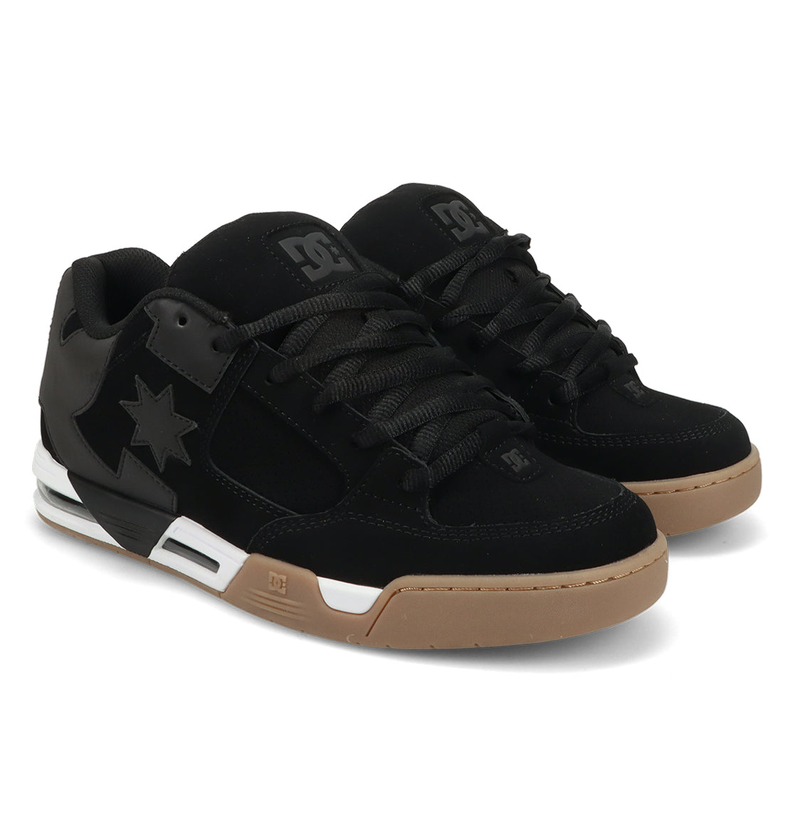 A pair of DC Shoes Men’s Command Shoes in black with thick gum soles, black laces, and a star logo on the side, featuring signature cushioning and classic DC bulk, positioned at an angle on a plain white background.