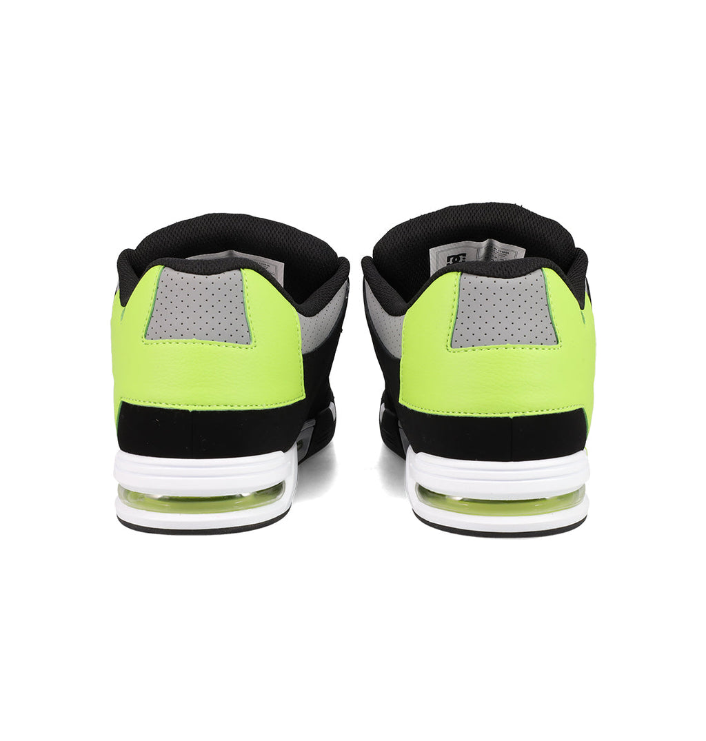 The Men's DC Command Shoes by DC Shoes are athletic sneakers featuring neon yellow, black, and gray panels with white midsoles and visible heel air cushioning, offering a street-ready look inspired by skate heritage.