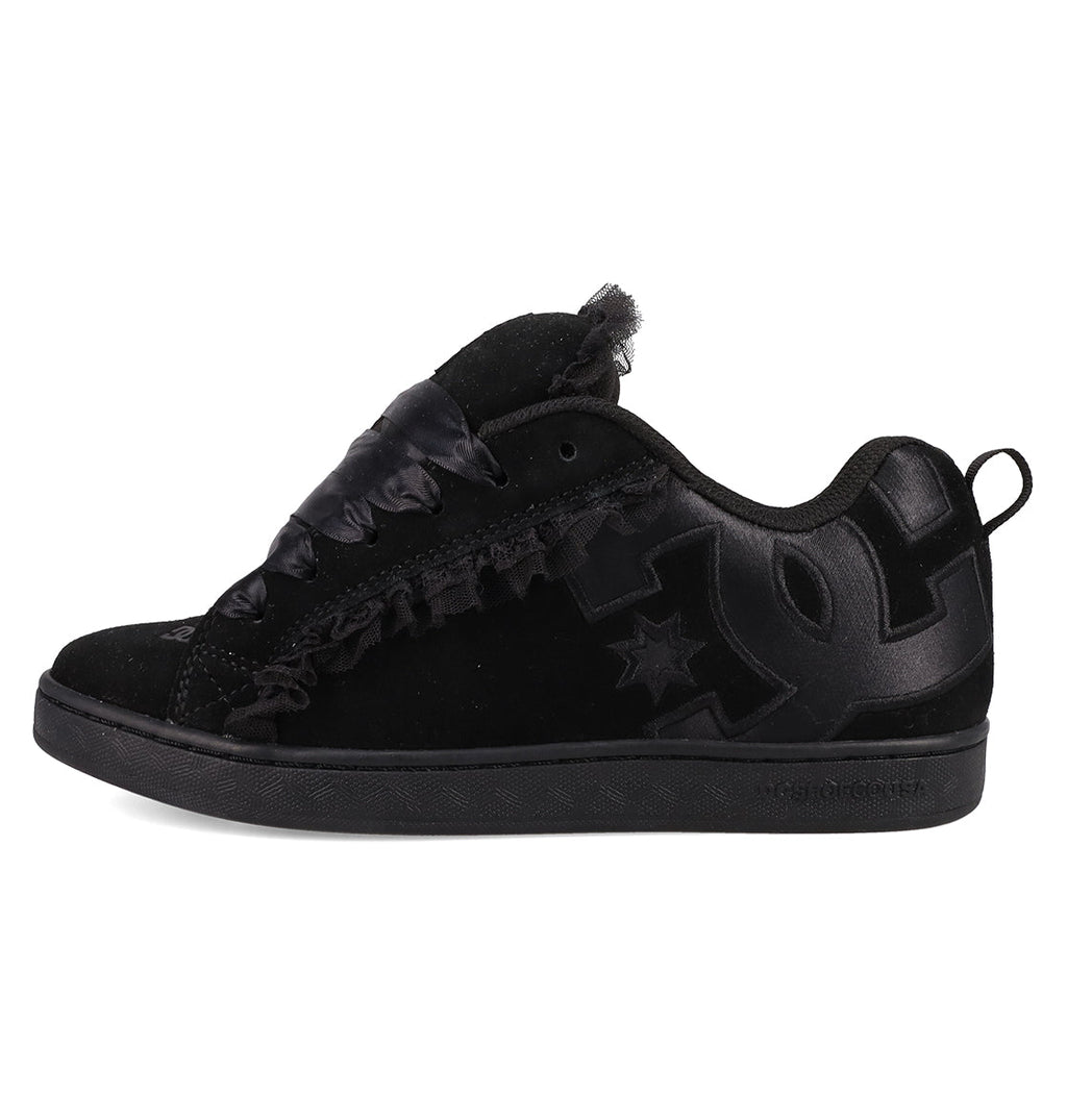 The Women's Court Graffik SD Shoes by DC Shoes feature a black suede upper, leather accents, large textured side logo, satin-style laces, low-top design, puffy silhouette, and an all-black sole for a sleek look.