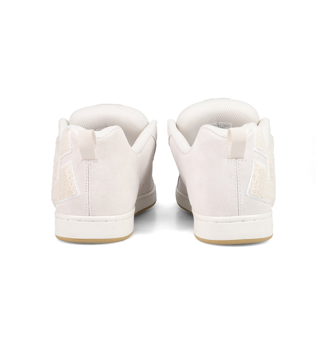 The DC Shoes Women's Court Graffik SD Shoes feature a white suede upper, padded collars, light tan soles, and textured heel details, shown from the back against a plain white background.