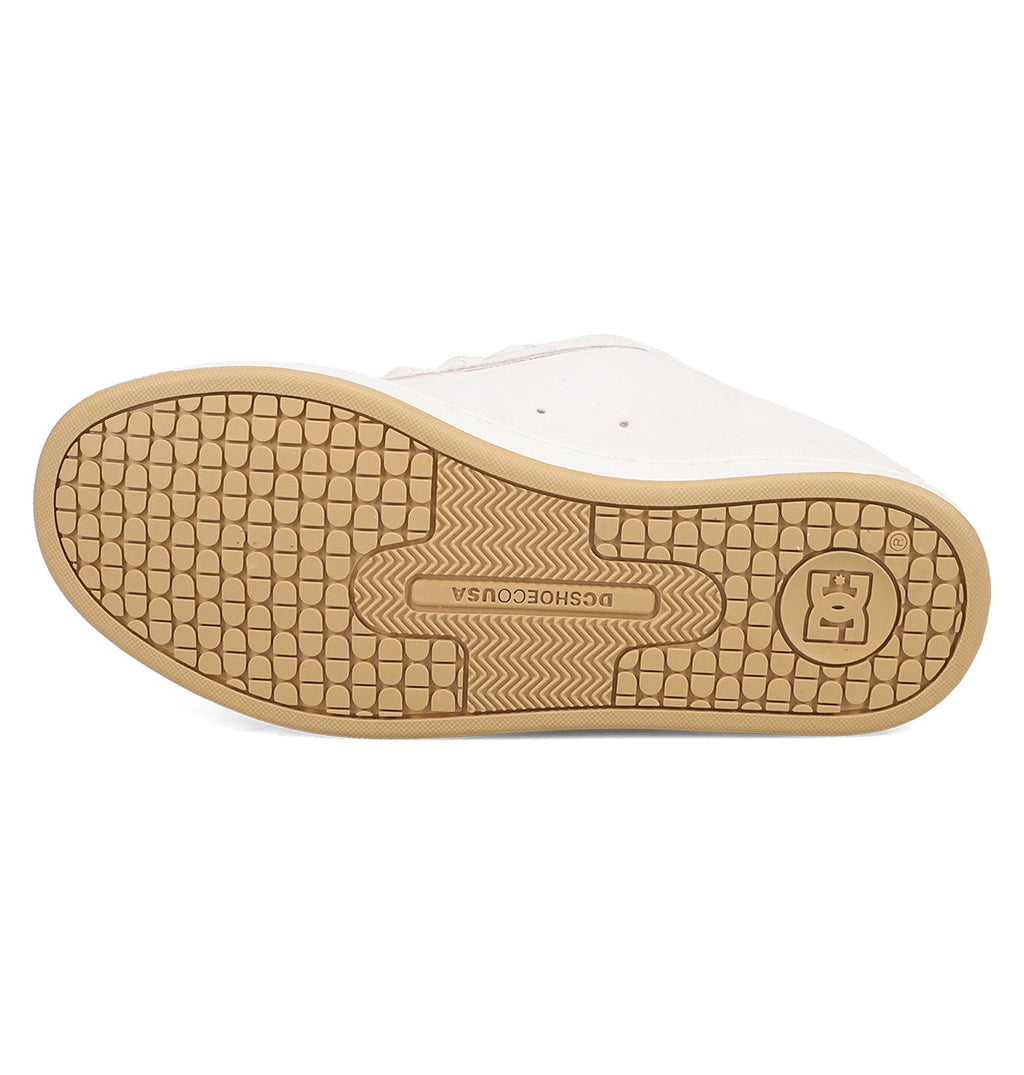 A tan rubber sole with textured grip and the DCSHOECOUSA logo features on the Women's Court Graffik SD Shoes by DC Shoes. The white suede upper edge adds a classic accent to this stylish footwear design.