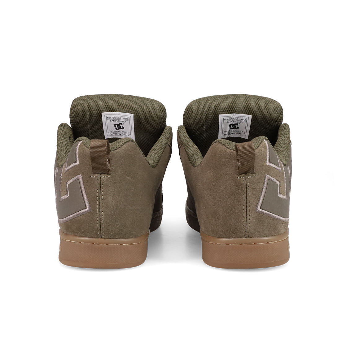 The Women's Court Graffik SD Shoes by DC Shoes are olive green suede sneakers viewed from the back, showing brown soles, padded collars for a puffy look, and white stitching on the heels.
