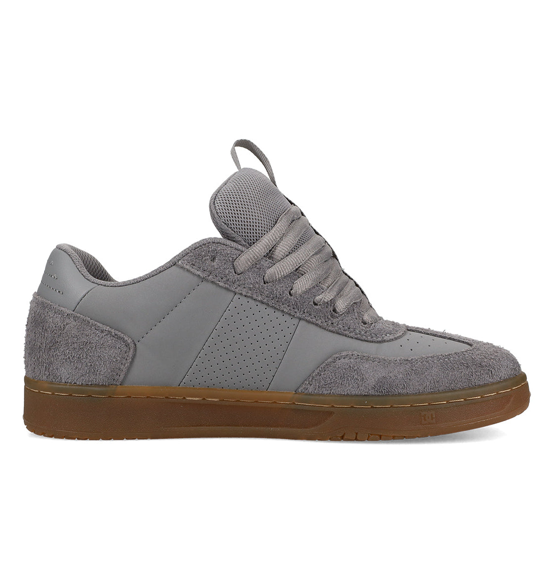 The DC Shoes Men’s Astrix Shoes are shown in a left side profile view against a white background, featuring a gray colorway with mixed suede and smooth textures, perforated side panel, thick laces, and a brown rubber sole. Designed for street skateboarding, they deliver enhanced board control with every step.