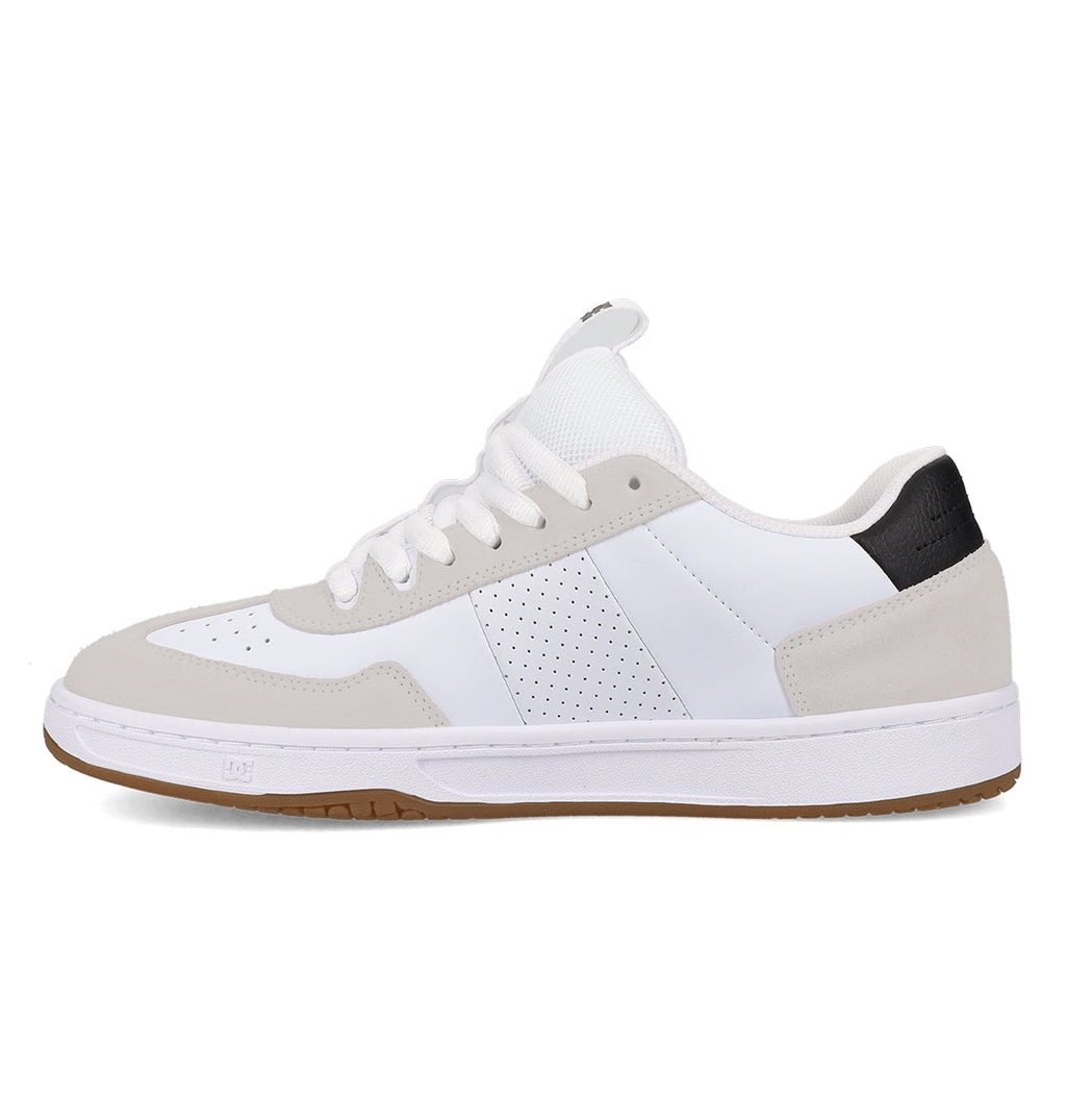 Introducing the Men’s Astrix Shoes from DC Shoes—a low-top skate shoe featuring a crisp white upper with light gray suede accents, perforated side panel for enhanced breathability, white laces, a contrasting black heel tab, and a gum rubber sole engineered for superior board control. Shown here in a left-facing side profile, these shoes are perfect for street skateboarding sessions.