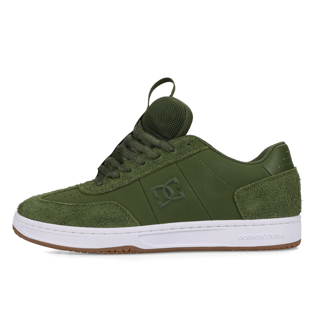 The DC Shoes Men’s Astrix Shoes are shown from a side profile on a white background. This green skate shoe features premium suede and mesh details for superior board control in street skateboarding, highlighted by a white sole, gum outsole, and the iconic DC logo on the side.