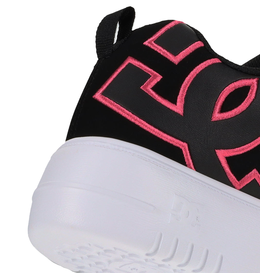 Close-up of the heel of a Women’s Court Graffik Platform Shoe by DC Shoes in black, featuring bright pink stitched branding and a chunky white sole. A black pull tab at the back completes this stylish women’s footwear option.