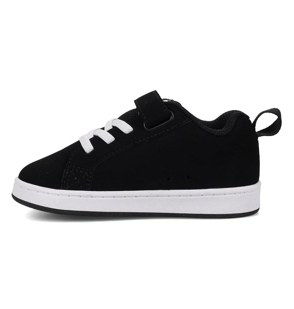 A small black sneaker, the Kids’ Court Graffik Shoes - Toddler by DC Shoes, features a puffy silhouette, white laces, a white sole, a black hook-and-loop strap, and a back pull tab—shown against a white background.